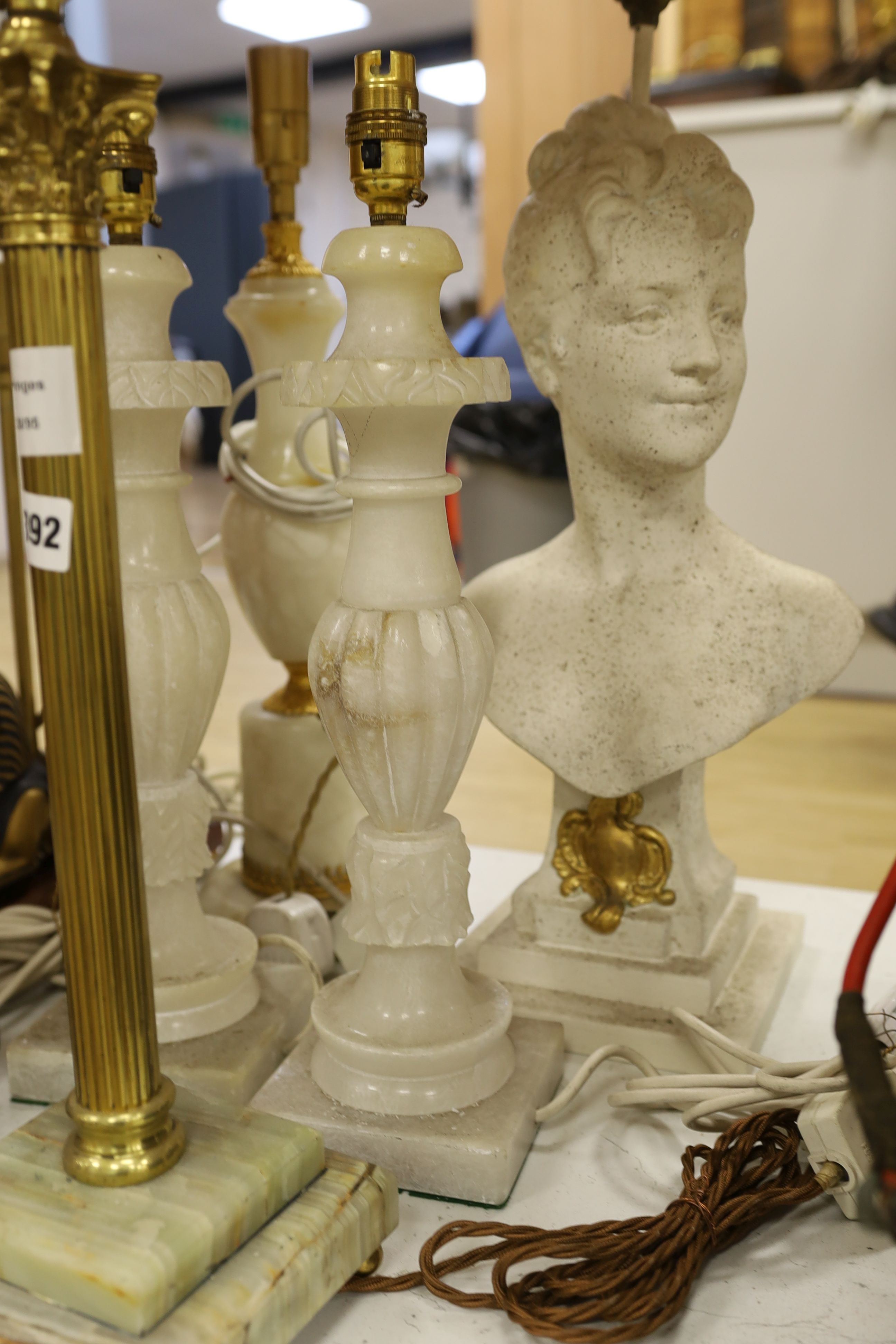 A selection of assorted table lamps including a sphinx-ed base and other decorative bases